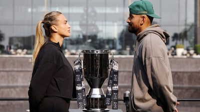 Nick Kyrgios and Aryna Sabalenka face-off with the trophy during the press conference (REUTERS)