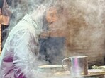 The young tea man was silently preparing a new round of chai. (Mayank Austen Soofi)
