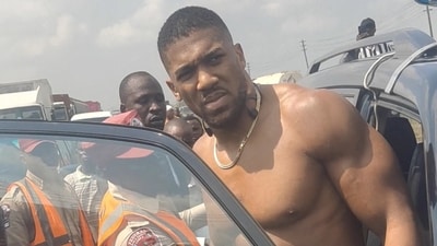 Anthony Joshua, after the car crash in  Ogun State, Nigeria getting in a car in this picture obtained from social media. Sodiq Ayo/via REUTERS  . (Sodiq Ayo via REUTERS)