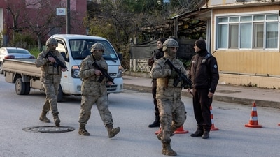 Turkish special forces team leaves the site where Turkish security forces launched an operation on a house believed to contain suspected Islamic State militants. (Reuters)