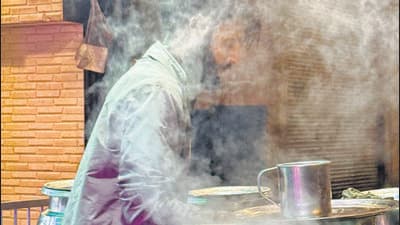 The young tea man was silently preparing a new round of chai. (Mayank Austen Soofi) The young tea man was silently preparing a new round of chai. (Mayank Austen Soofi)