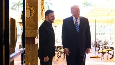 US President Donald Trump (R) welcoming Ukranian President Volodymyr Zelensky (L) prior to their talks on ending the war with Russia at Trump's Mar-a-Lago estate in Palm Beach, Florida. (AFP)