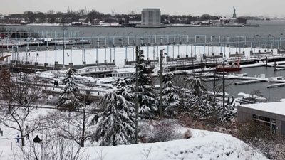Snow covers Brooklyn Bridge Park in New York City on December 27, 2025. New York City receieved around 4 inches of snow overnight. (AFP) Snow covers Brooklyn Bridge Park in New York City on December 27, 2025. New York City receieved around 4 inches of snow overnight. (AFP)