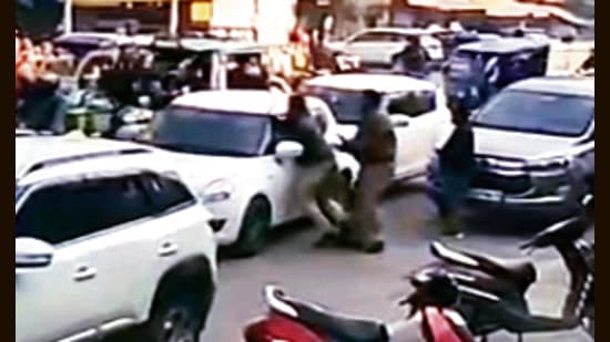 A video grab shows police trying to apprehend the gang’s vehicle at Dandi Swami Chowk in Ludhiana; (right) a damaged car that was hit by the suspect’s vehicle. (HT Photo)