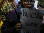 A woman holds a placard during a protest seeking justice for the Unnao rape case victim outside Parliament House on Dec. 27 (PTI)