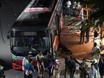 Dinesh Jain, who owns a shop opposite the Bhandup bus stop, said that he had just stepped out of his shop for some work when he suddenly saw a bus ram into people and climb onto the footpath. (Raju Shinde/HT Photo)