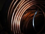 Copper prices hit a record just below $13,000 a tonne in an end-of-year surge, before paring gains.