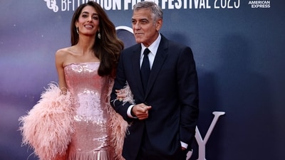 US actor George Clooney poses with his wife Amal Clooney on the red carpet upon arrival to attend the Gala screening of "Jay Kelly" at the Royal Festival Hall, during the 2025 BFI London Film Festival in London, on October 10, 2025 (AFP) US actor George Clooney poses with his wife Amal Clooney on the red carpet upon arrival to attend the Gala screening of "Jay Kelly" at the Royal Festival Hall, during the 2025 BFI London Film Festival in London, on October 10, 2025 (AFP)