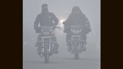 Bikers make their way amid dense fog on Friday morning. (Manish/HT) Bikers make their way amid dense fog on Friday morning. (Manish/HT)