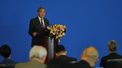 China's Foreign Minister Wang Yi delivers the opening speech on stage for the annual symposium on the international situation and China's foreign relations held by China Institute of International Studies at the Diaoyutai State Guesthouse, in Beijing, on Tuesday (AP) China's Foreign Minister Wang Yi delivers the opening speech on stage for the annual symposium on the international situation and China's foreign relations held by China Institute of International Studies at the Diaoyutai State Guesthouse, in Beijing, on Tuesday (AP)