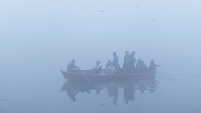 People ride a boat in the waters of river Yamuna on a cold and foggy winter morning in New Delhi, India, December 30, 2025. (REUTERS)