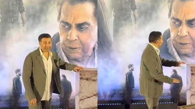 Sunny Deol posing with Dharmendra's poster at Ikkis screening. Sunny Deol posing with Dharmendra's poster at Ikkis screening.