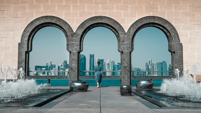View of Doha skyline through Islamic arches at Museum of Islamic Art, Qatar. View of Doha skyline through Islamic arches at Museum of Islamic Art, Qatar.