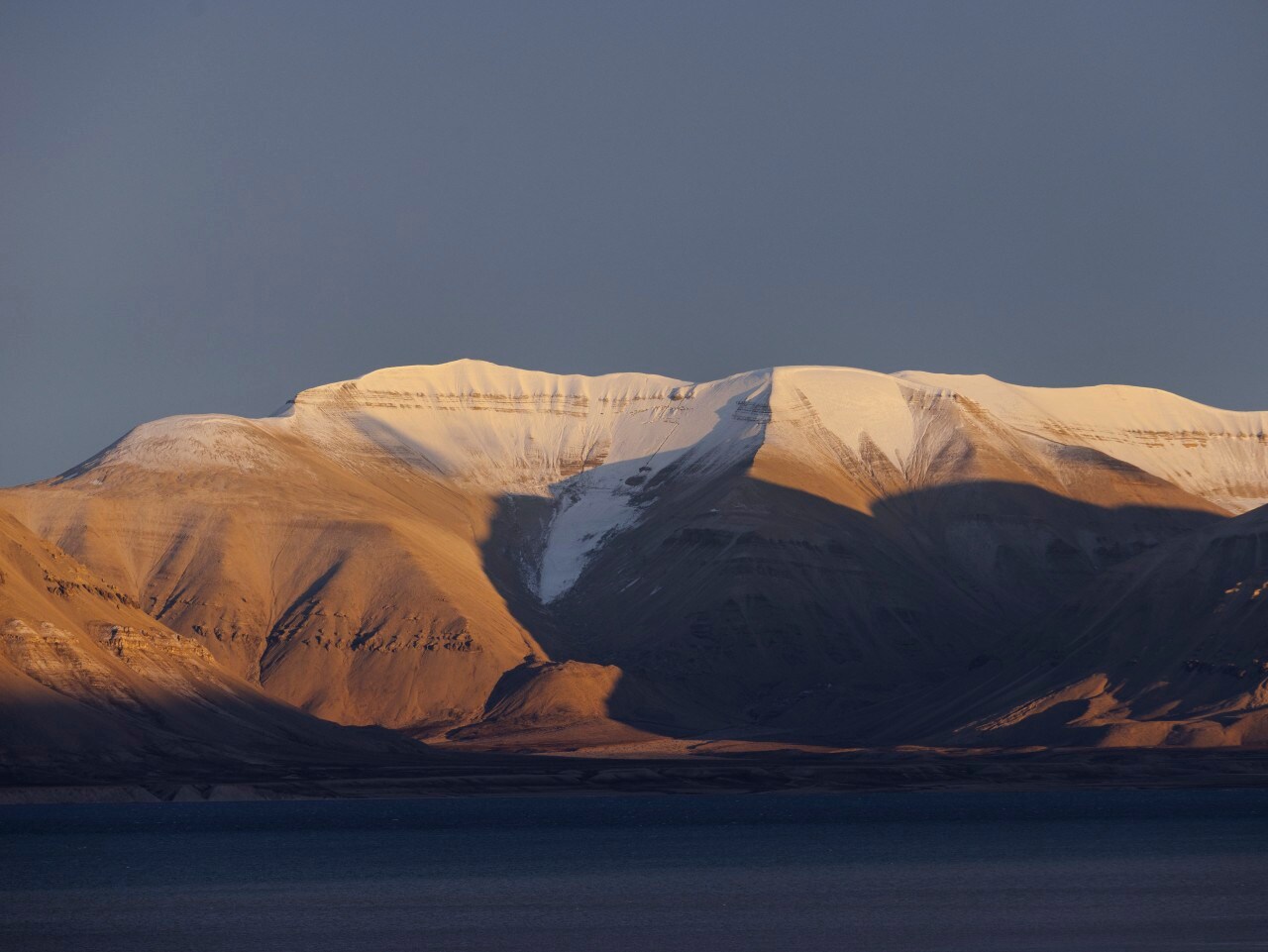 Mountains in the Norwegian archipelago of Svalbard in the Arctic Circle. Mountains in the Norwegian archipelago of Svalbard in the Arctic Circle.