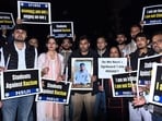 NSUI members hold a candle march to protest the mob lynching of student Angel Chakma, at Jantar Mantar, in New Delhi on Tuesday.