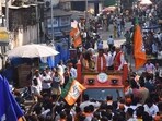 BJP candidates Harshita Narwekar and Makarand Suresh Narwekar on their way to file nomination forms on Tuesday (Bhushan Koyande/HT Photo)