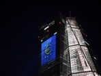 A projection of a Euro currency sign is pictured on the facade of the European Central Bank (ECB) headquarters in Frankfurt, in celebration of Bulgaria's accession to the euro area. 