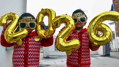 Children pose for a picture by holding a '2026' cutout ahead of New Year celebrations, in Prayagraj on Tuesday. (ANI) Children pose for a picture by holding a '2026' cutout ahead of New Year celebrations, in Prayagraj on Tuesday. (ANI)