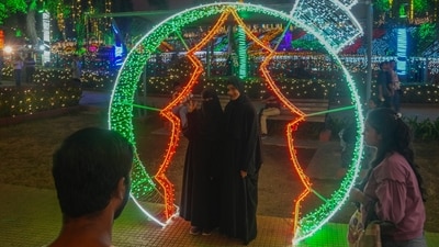 Muslim women's poses for picture near illuminated decorations on New Year's Eve in Mumbai. (AP) Muslim women's poses for picture near illuminated decorations on New Year's Eve in Mumbai. (AP)