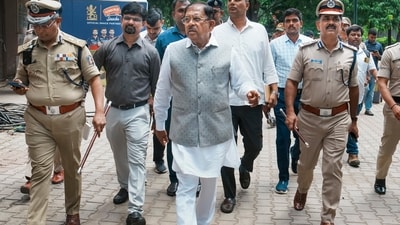 Karnataka Home Minister G Parameshwara with Bengaluru City Commissioner of Police B Dayananda and other police personnel. (PTI) Karnataka Home Minister G Parameshwara with Bengaluru City Commissioner of Police B Dayananda and other police personnel. (PTI)