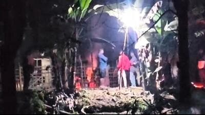 The house of Gardi and Mira Birowa being burnt by locals at Beloguri Munda village in the Howraghat area of Karbi Anglong. (Screengrab) The house of Gardi and Mira Birowa being burnt by locals at Beloguri Munda village in the Howraghat area of Karbi Anglong. (Screengrab)