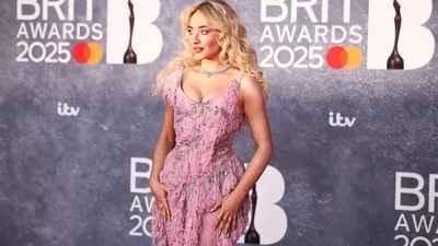 Sabrina Carpenter turned heads in a gorgeous custom Alexander McQueen gown at Brit Awards 2025. The baby pink gown had ruched detailing with a neat, scoop neckline. The diamond choker with pink gem in the center complemented her look. (AFP) Sabrina Carpenter turned heads in a gorgeous custom Alexander McQueen gown at Brit Awards 2025. The baby pink gown had ruched detailing with a neat, scoop neckline. The diamond choker with pink gem in the center complemented her look. (AFP)