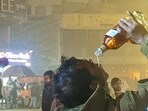 People seen drinking liquor openly on New year’s Eve in Gurugram. (HT)