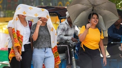 Women shield themselves from the sun in New Delhi. (PTI File) Women shield themselves from the sun in New Delhi. (PTI File)