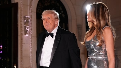 The US President was dressed in a classic black tuxedo and white shirt, while the First Lady was seen in a silhouette silver dress. (AP) The US President was dressed in a classic black tuxedo and white shirt, while the First Lady was seen in a silhouette silver dress. (AP)