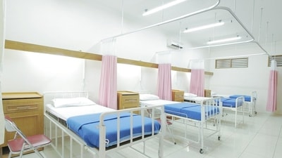 A woman attended an office meeting from a hospital bed and her viral video sparked debate on corporate pressure. (Representational image/Unsplash) A woman attended an office meeting from a hospital bed and her viral video sparked debate on corporate pressure. (Representational image/Unsplash)