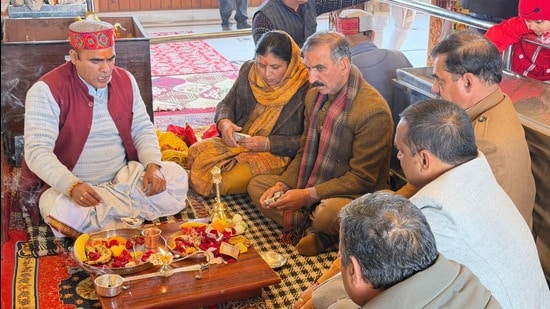 Himachal chief minister Sukhvinder Singh Sukhu with his wife on Thursday. (HT Photo)