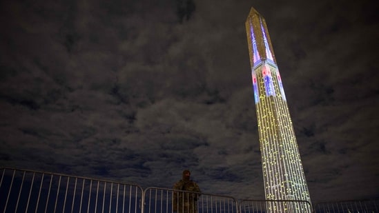 The Washington Monument is illuminated with a projection of US President Donald Trump's "Freedom 250" initiative during the New Year's Eve show at the National Mall in Washington,.(AFP)