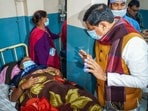 Madhya Pradesh Chief Minister Mohan Yadav meets an affected person undergoing treatment after consumption of contaminated water, at a hospital in Indore.