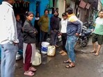Residents gather amid the contaminated tap water crisis at Bhagirathpura, in Indore.