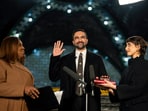 Zohran Mamdani being sworn in as New York mayor on New Year’s Day, wearing a black overcoat and an Eri silk tie