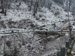 Vehicles stuck in a traffic jam due to heavy snowfall on the highway from Solang Valley to Atal Tunnel, in Manali on Thursday. (ANI) Vehicles stuck in a traffic jam due to heavy snowfall on the highway from Solang Valley to Atal Tunnel, in Manali on Thursday. (ANI)