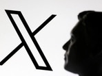 A 3D-printed miniature model of Elon Musk and the X logo are seen in this illustration. REUTERS/Dado Ruvic/Illustration/File Photo