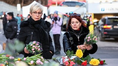 People leave flowers outside the "Le Constellation" bar, in the memory of those who died in the tragedy. (REUTERS)