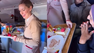Emirates cabin crew surprised a couple with a mid air wedding anniversary celebration. (Instagram/napkin786) Emirates cabin crew surprised a couple with a mid air wedding anniversary celebration. (Instagram/napkin786)