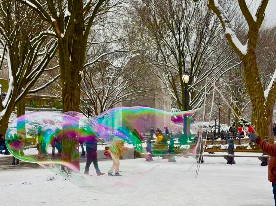 My son and I walked past a man blowing large bubbles into the wind, their giant skins forming a psychedelic rainbow. I felt lighter, able to place my “trials” in perspective. (Mridula Ramesh) My son and I walked past a man blowing large bubbles into the wind, their giant skins forming a psychedelic rainbow. I felt lighter, able to place my “trials” in perspective. (Mridula Ramesh)