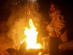 A local resorts to a makeshift fire on Saturday morning, as Gurugram witnesses one of the coldest days of this season. (PTI) A local resorts to a makeshift fire on Saturday morning, as Gurugram witnesses one of the coldest days of this season. (PTI)