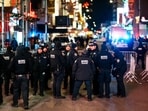 NYPD officers stand guard in Times Square during New Year's Eve celebrations, Wednesday
