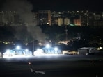 Smoke raises at La Carlota airport after explosions and low-flying aircraft were heard in Caracas, Venezuela, Saturday Smoke raises at La Carlota airport after explosions and low-flying aircraft were heard in Caracas, Venezuela, Saturday