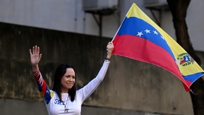 Venezuelan opposition leader Maria Corina Machado waves a national flag during a protest called by the opposition on the eve of the presidential inauguration, in Caracas on January 9, 2025. (AFP/ File) Venezuelan opposition leader Maria Corina Machado waves a national flag during a protest called by the opposition on the eve of the presidential inauguration, in Caracas on January 9, 2025. (AFP/ File)
