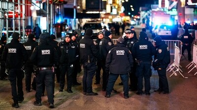 NYPD officers stand guard in Times Square during New Year's Eve celebrations, Wednesday (AP) NYPD officers stand guard in Times Square during New Year's Eve celebrations, Wednesday (AP)