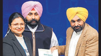 Punjab chief minister Bhagwant Mann hands over an appointment letter to a selected candidate in Chandigarh on Saturday. (ANI) Punjab chief minister Bhagwant Mann hands over an appointment letter to a selected candidate in Chandigarh on Saturday. (ANI)