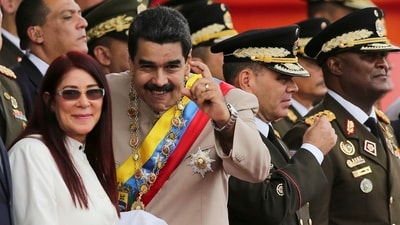 While talking about the whereabouts of Maduro and his wife Cilia Flores, Trump said they were aboard a US warship and will face prosecution in New York. (File Photo/AP) While talking about the whereabouts of Maduro and his wife Cilia Flores, Trump said they were aboard a US warship and will face prosecution in New York. (File Photo/AP)