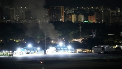 Smoke raises at La Carlota airport after explosions and low-flying aircraft were heard in Caracas, Venezuela, Saturday (AP) Smoke raises at La Carlota airport after explosions and low-flying aircraft were heard in Caracas, Venezuela, Saturday (AP)