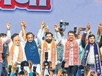 CM Devendra Fadnavis, deputy CM Eknath Shinde, and RPI chief Ramdas Athawale at a joint rally in Worli on Saturday. (Raju Shinde/HT Photo)