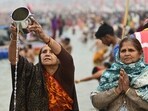 Devotees offering prayers after the holy dip at Sangam on Saturday. (Anil Kumar Maurya/HT)